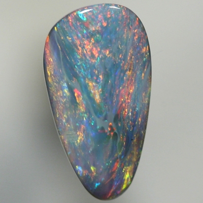 SOLID SEMI BLACK OPAL Red and orange sparkle over a green blue background